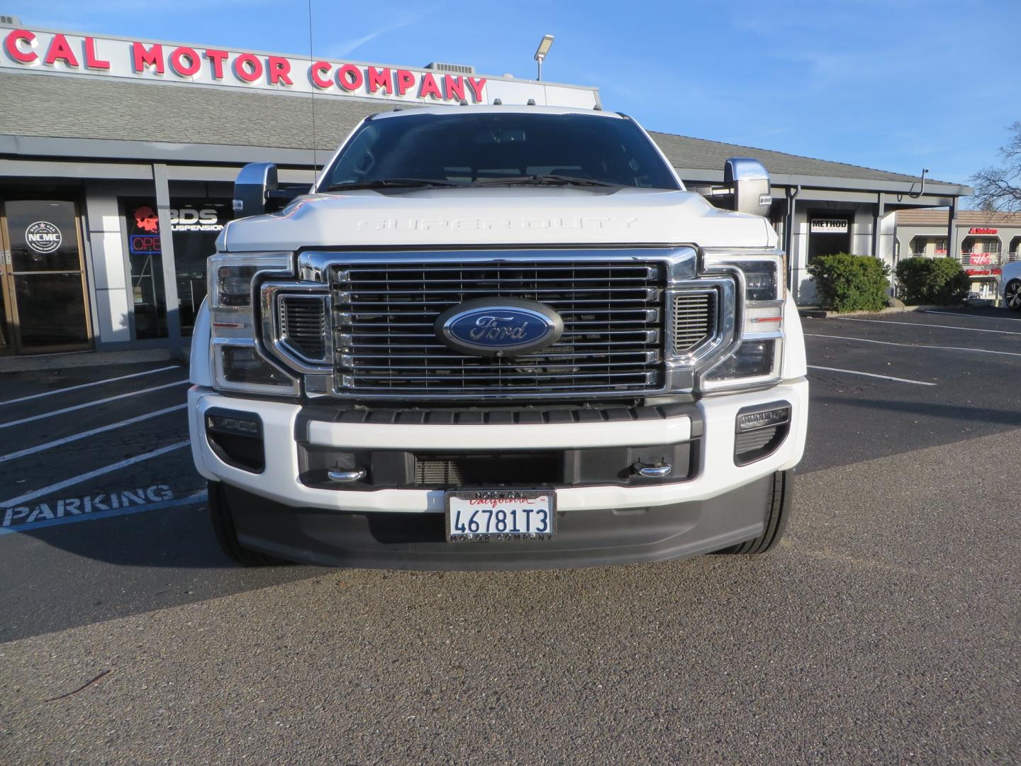 2020 White /BLACK Ford F-450 SD PlatinumCrew Cab DRW 4WD (1FT8W4DT4LE) with an 6.7L V8 OHV 16V DIESEL engine, 6A transmission, located at 2630 Grass Valley Highway, Auburn, CA, 95603, (530) 508-5100, 38.937893, -121.095482 - Must see F450 with a tool box refueling station, window tint, and a center console vault. - Photo#1